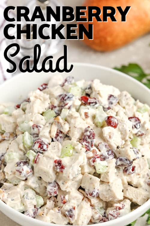 cranberry chicken salad in a bowl with text