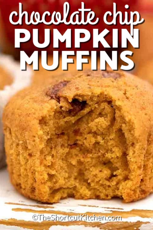 a pumpkin chocolate chip muffin sitting on a wooden board, with a title