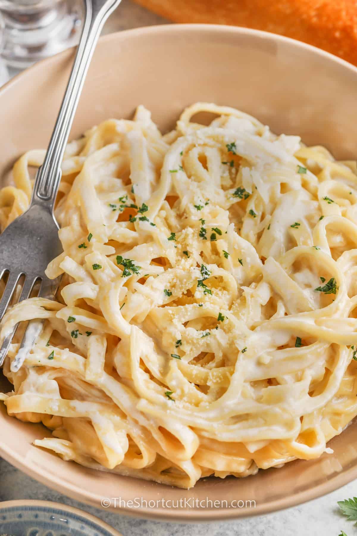 a serving of fettuccine alfredo in a bowl