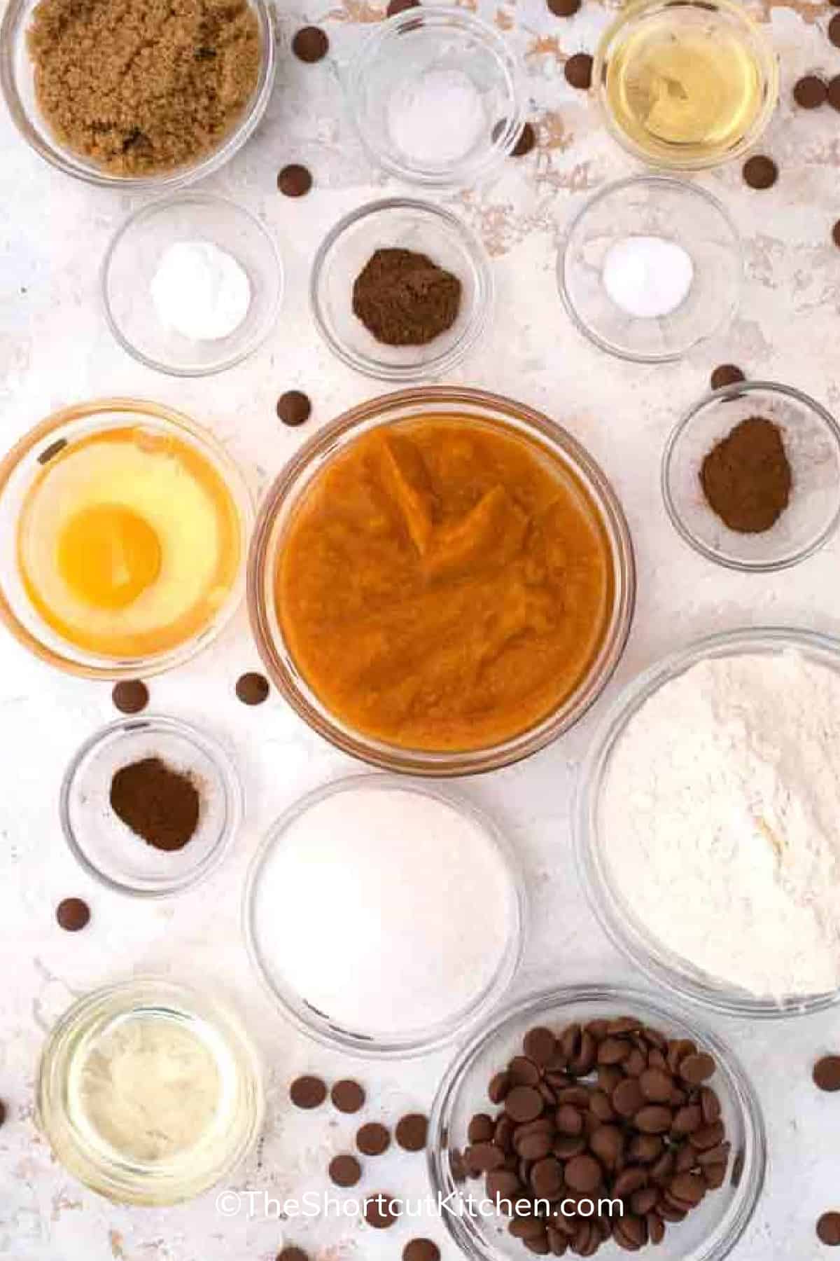 pumpkin chocolate chip muffins recipe ingredients on a white background