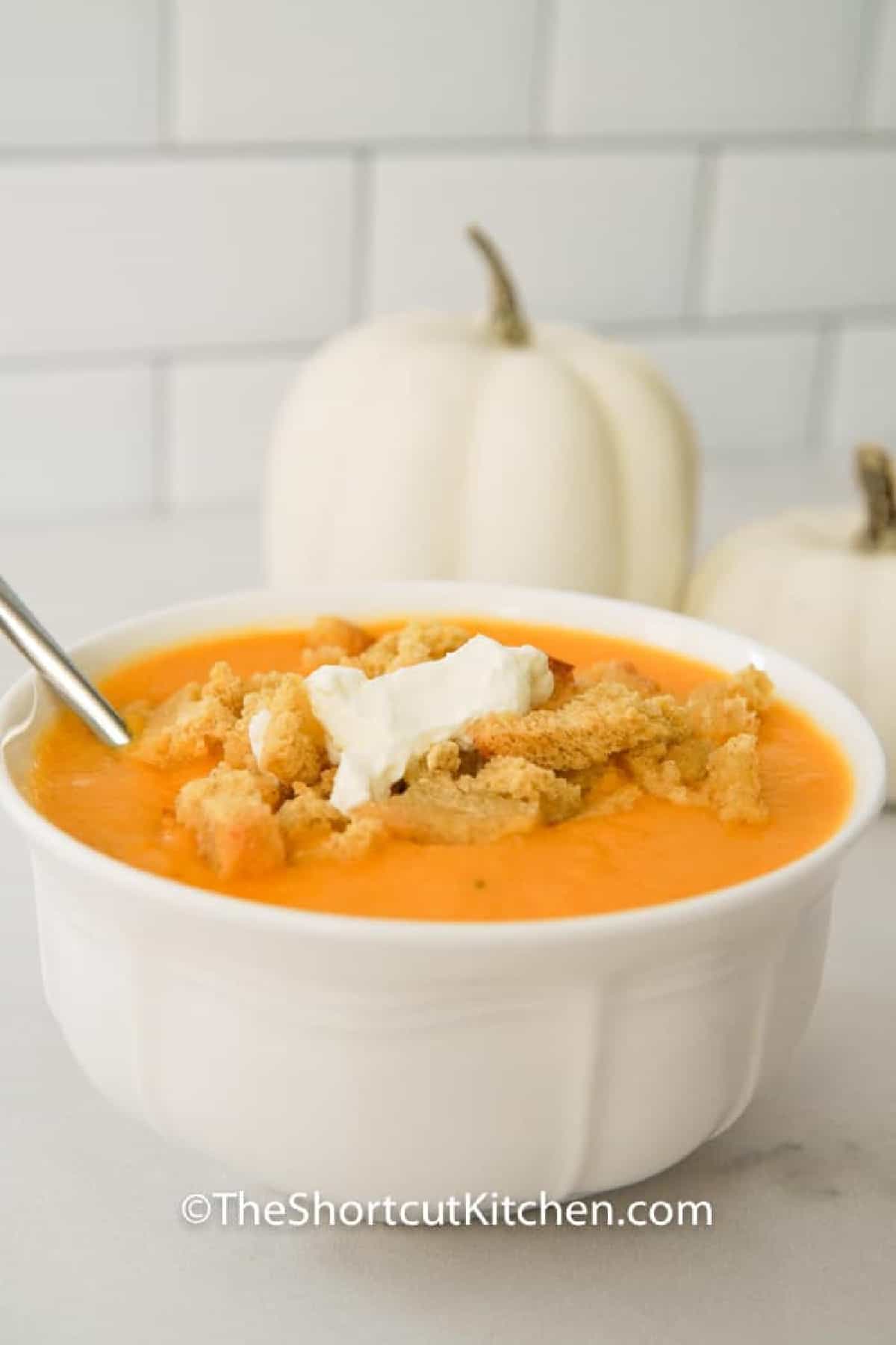 white bowl filled with roasted butternut squash soup