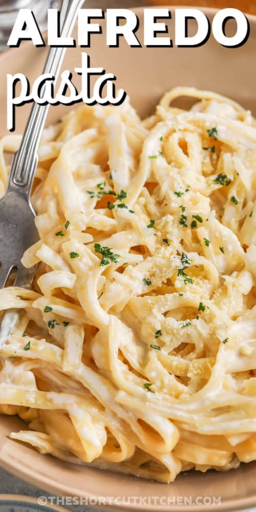 A bowl of fettuccine alfredo with text