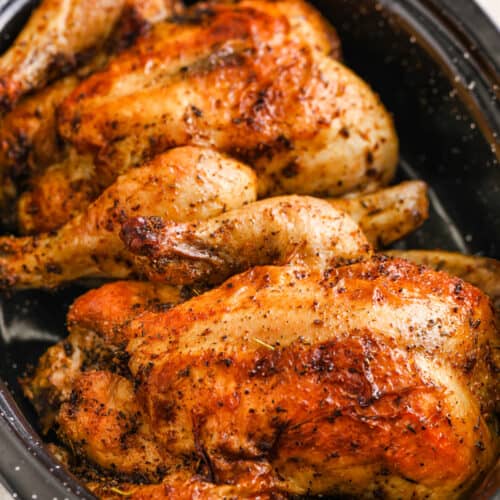 Two baked Cornish Hen in a roasting pan