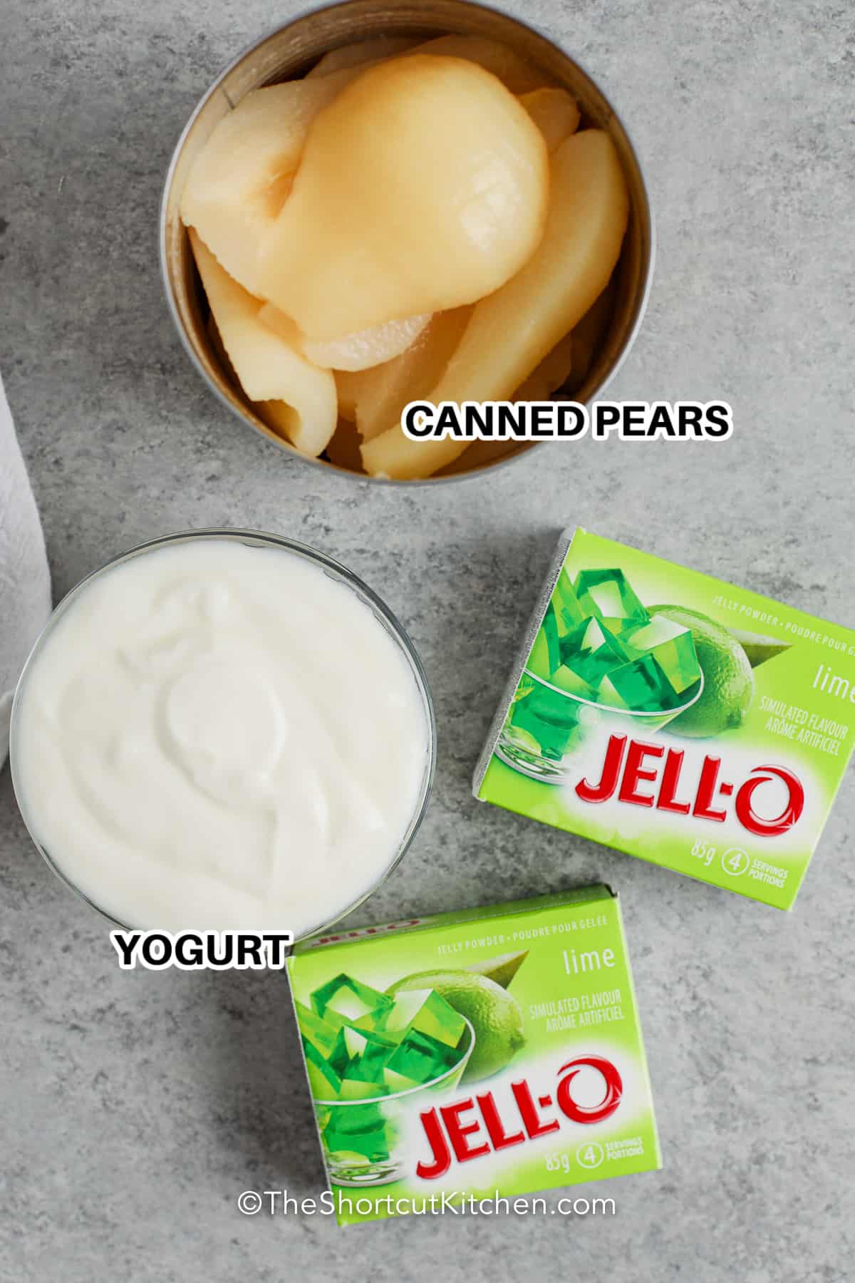 ingredients to make Lime Jello Salad including canned pears, yogurt, and jello