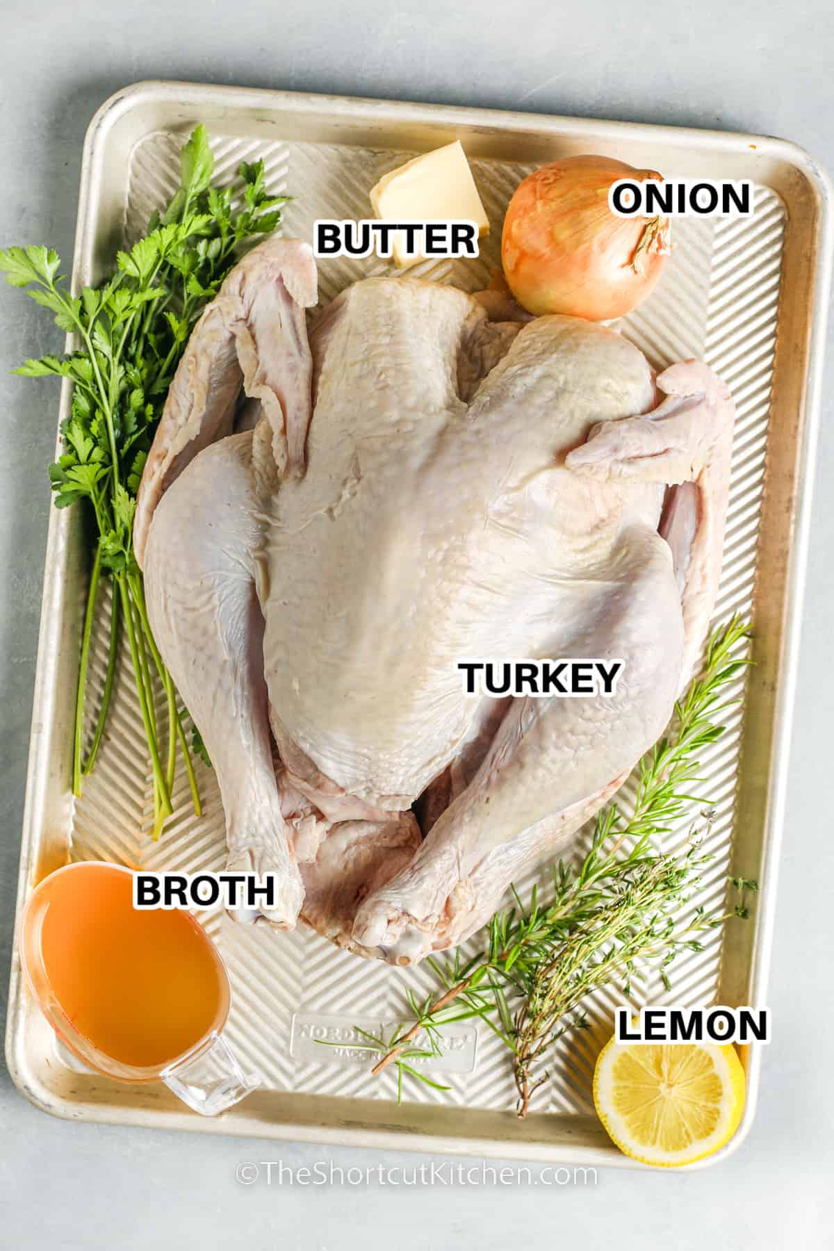 ingredients for Roast Turkey Recipe including turkey, butter, onion, broth, and lemon