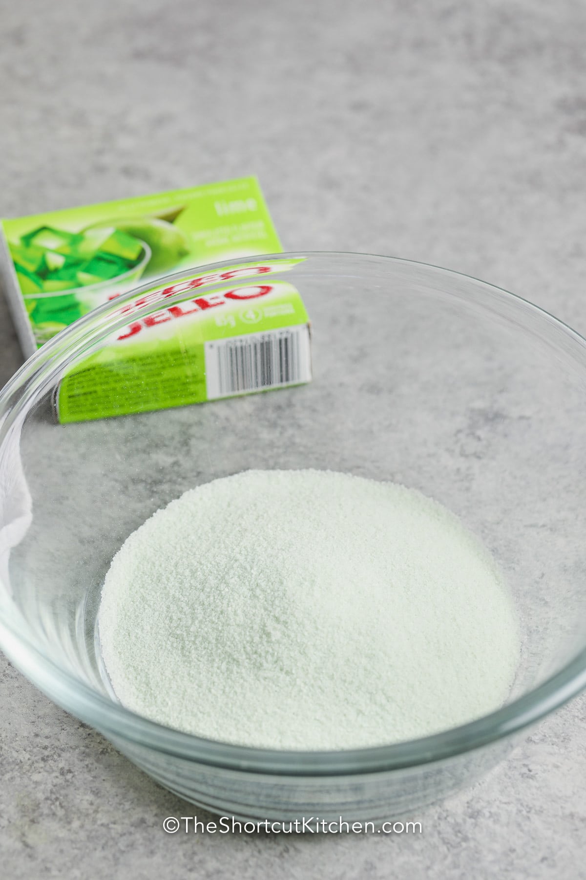 jello powder in a bowl for Lime Jello Salad
