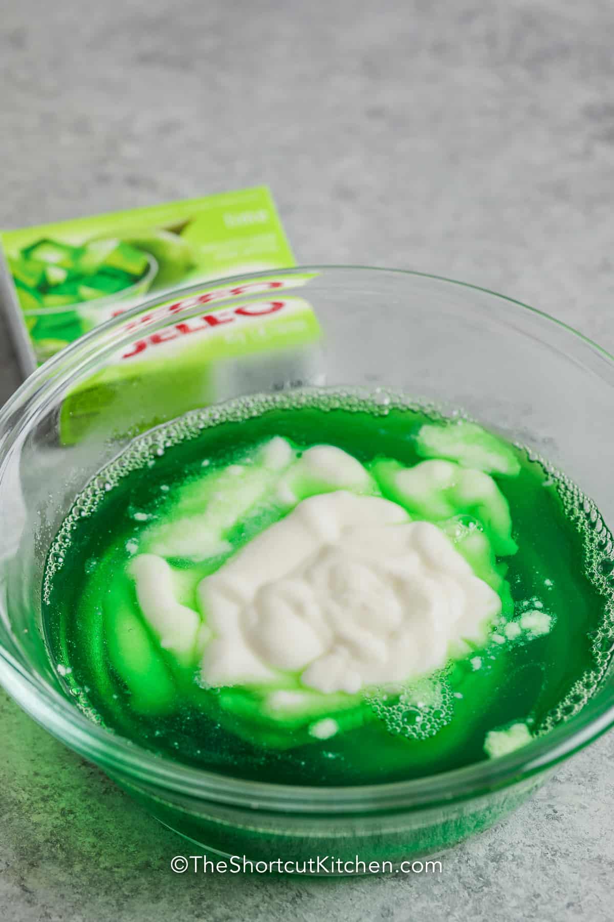 yogurt and jello mixture in a bowl before being mixed