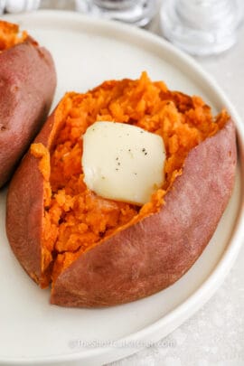 sweet potato cut in half with butter