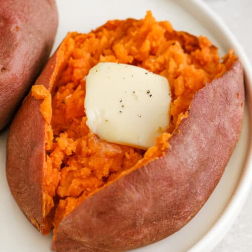 sweet potato cut in half with butter