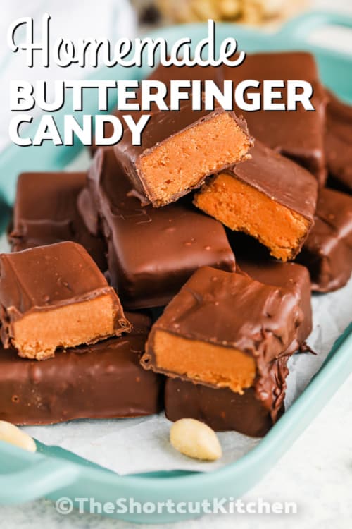 homemade butterfinger pieces on a serving plate with writing