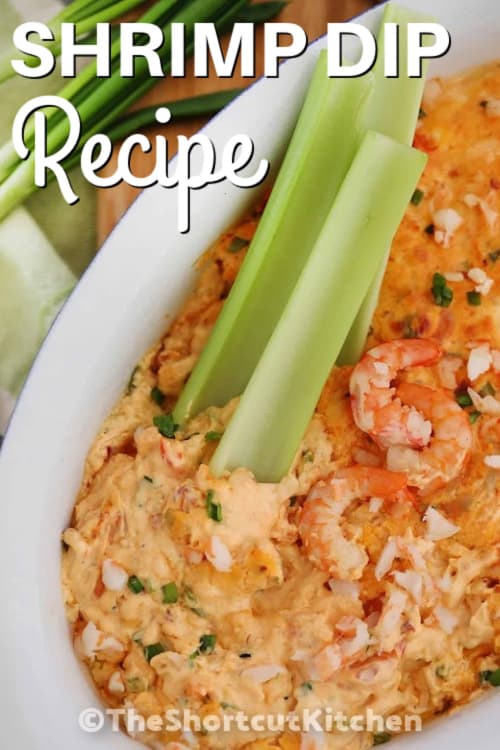 Shrimp dip in a white bowl with three celery sticks and shrimp on top, with a title