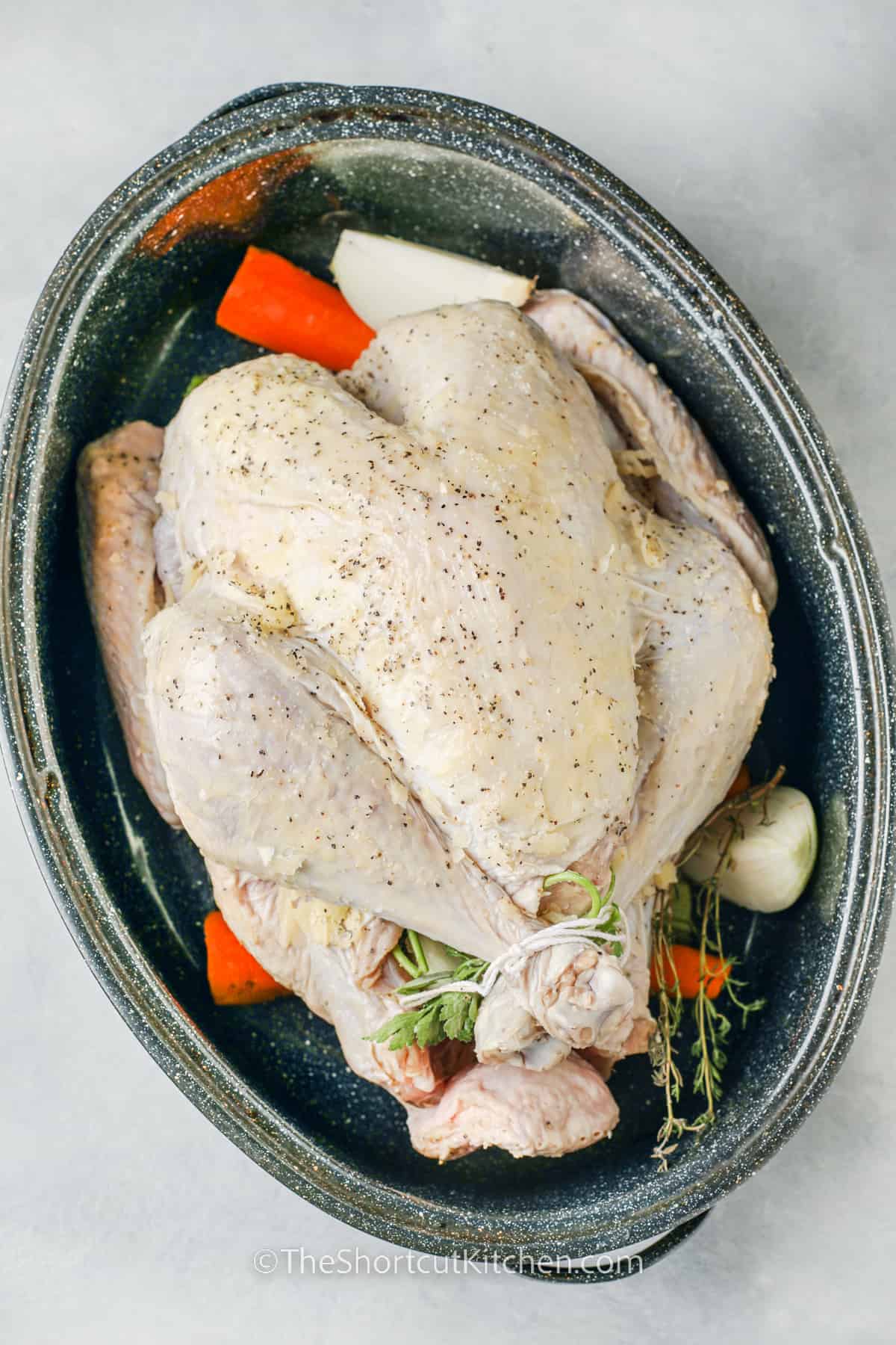 raw turkey in a roasting pan for Roast Turkey