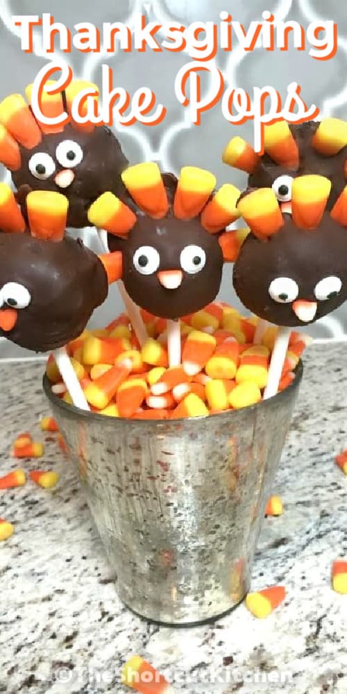 Thanksgiving cake pops in a cup with candy corn and a title