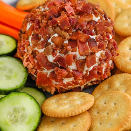 Bacon Ranch Cheese Ball on a plate with crackers and veggies