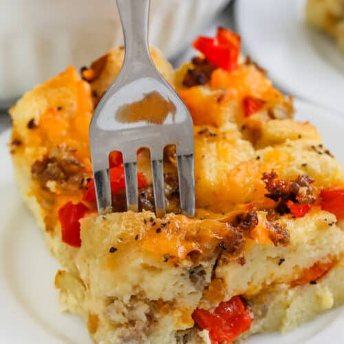 fork piercing a piece of sausage and egg breakfast casserole