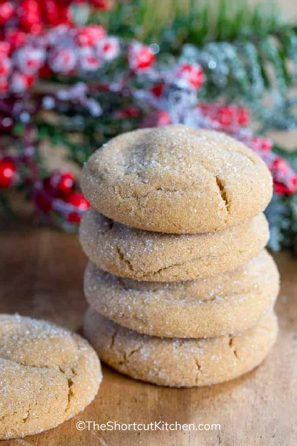 Molasses Cookies in a stack on a wooden board
