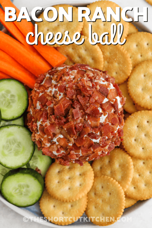 Bacon Ranch Cheese Ball on a plate with veggies and crackers and a title