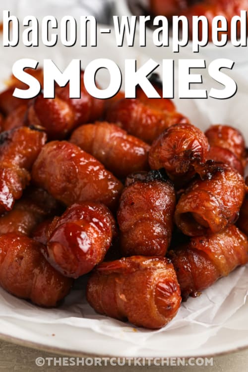 bacon wrapped smokies on a plate with a title
