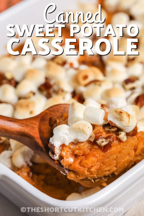 canned sweet potato casserole being served with a wooden spoon from a white casserole dish, with a title