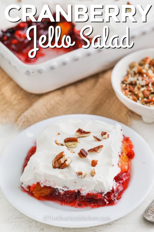 piece of cranberry jello salad on a plate with a title