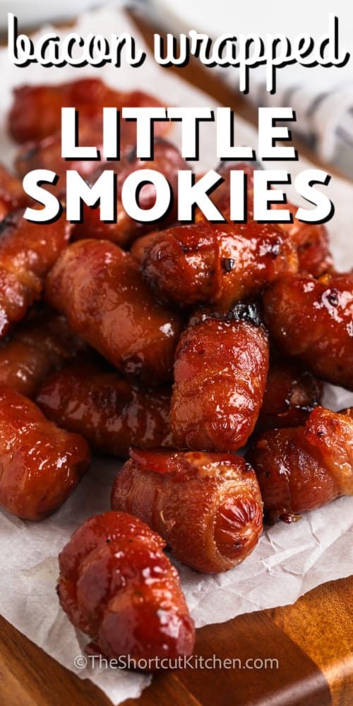 bacon wrapped smokies on parchment paper with writing