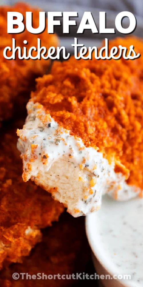 Crispy buffalo chicken tenders piled together, one with a bite taken out of it, with a title.