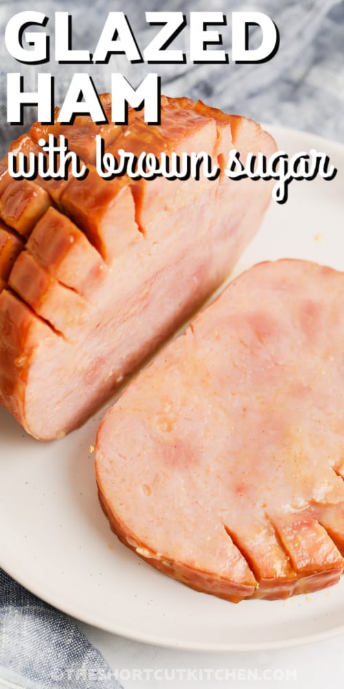 Crockpot brown sugar ham on a white plate with writing