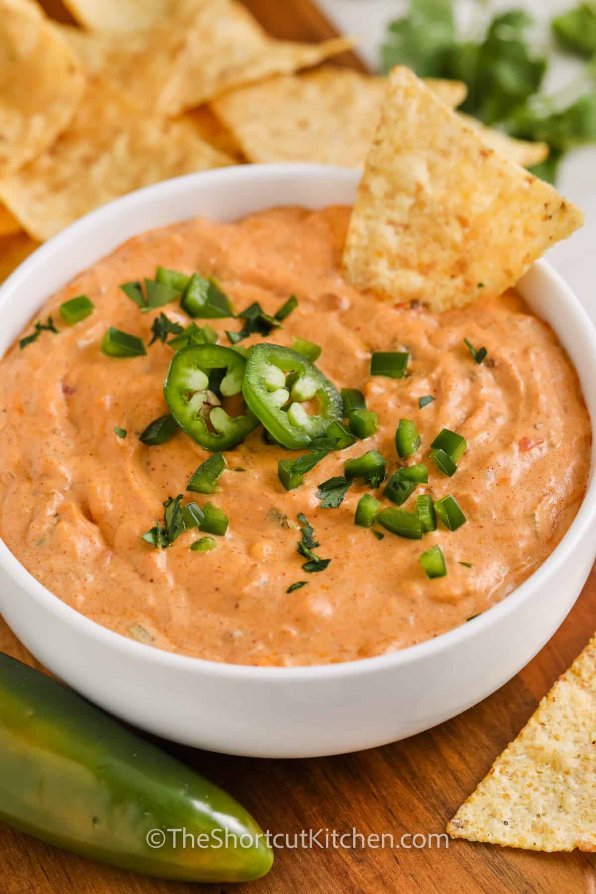 dish of Chili Cheese Dip Recipe with tortilla chips