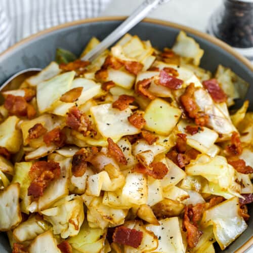 fried cabbage with bacon in a dish