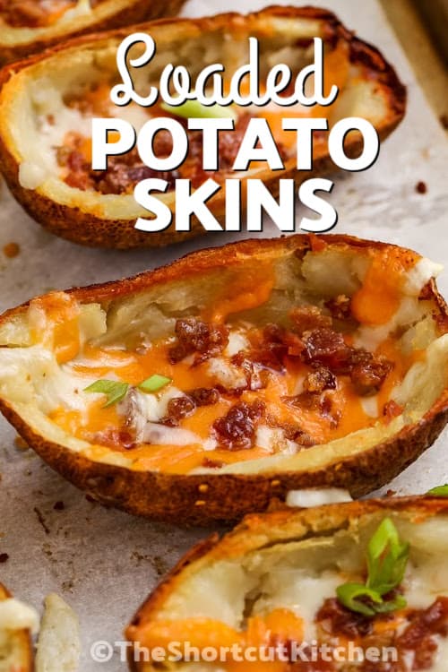 loaded potato skins on a baking sheet with text