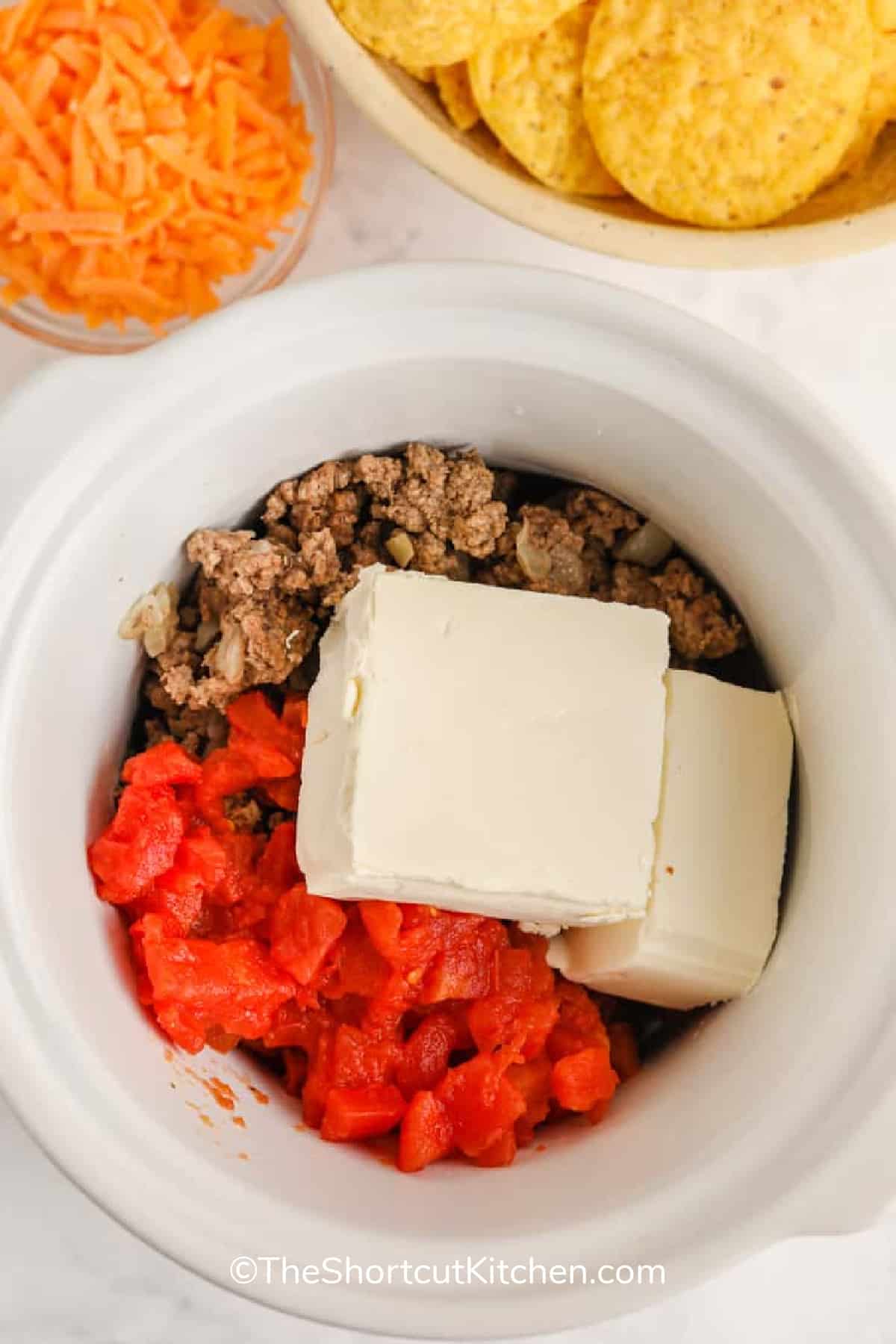 Ingredients to make this cream cheese Rotel dip recipe in a small Crockpot