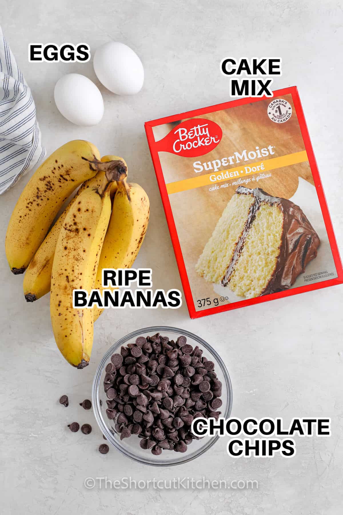 cake mix , eggs , chocolate chips and ripe bananas with labels to make Cake Mix Banana Bread