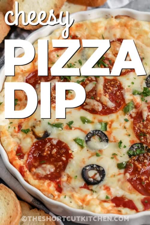 easy Cheesy Pizza Dip in a white bowl with writing