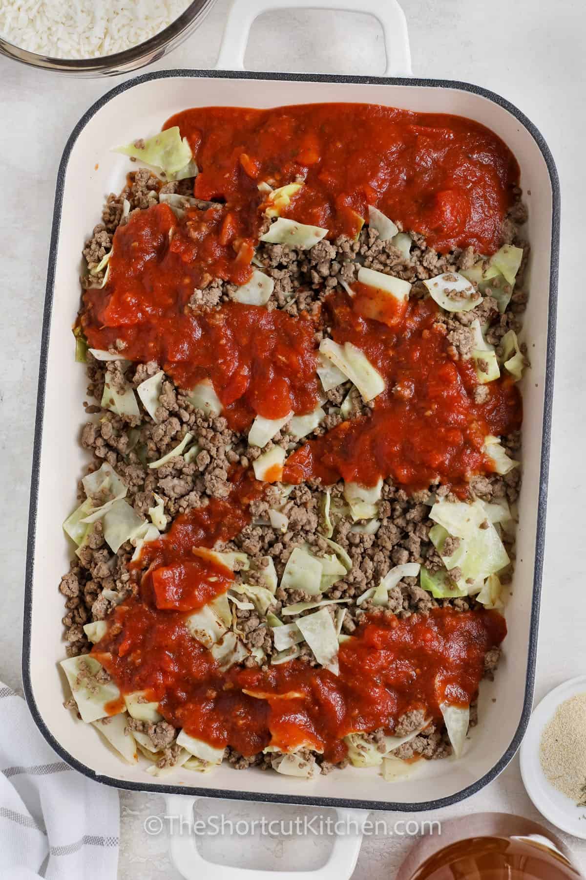 Ingredients to make Cabbage Roll Casserole in a casserole dish
