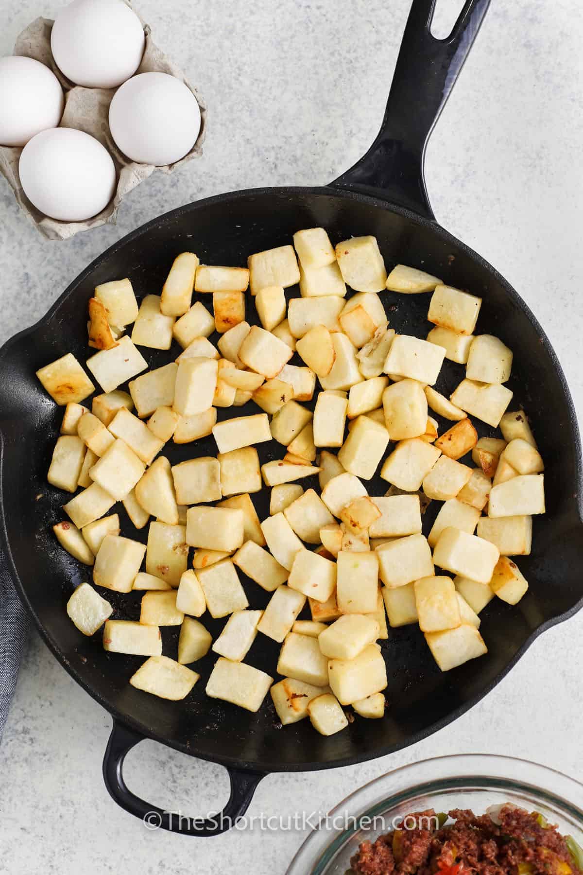 cooking potatoes to make Canned Corned Beef Hash