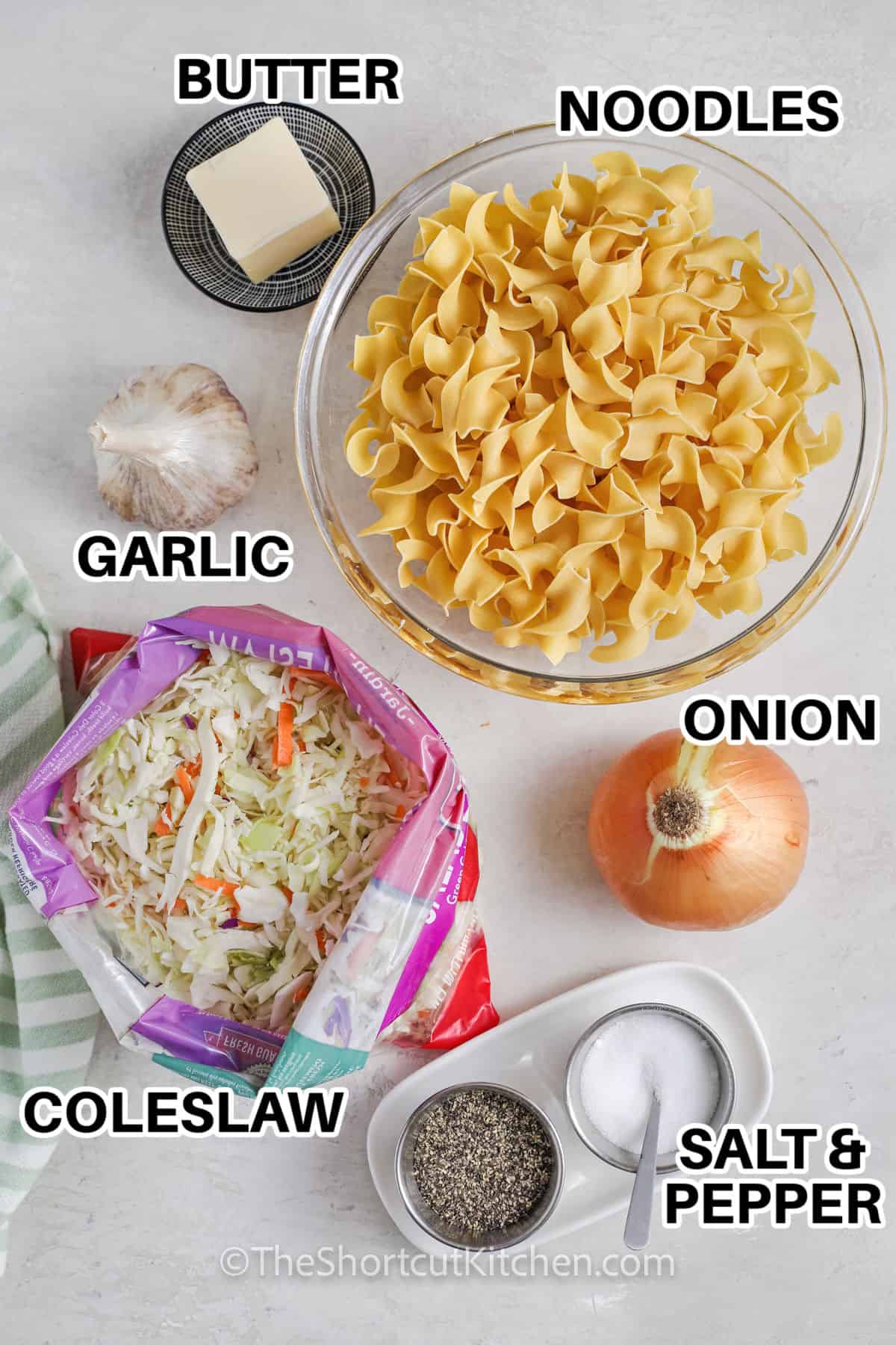 noodles , butter , garlic , onion , coleslaw , salt and pepper with labels to make Cabbage and Noodles