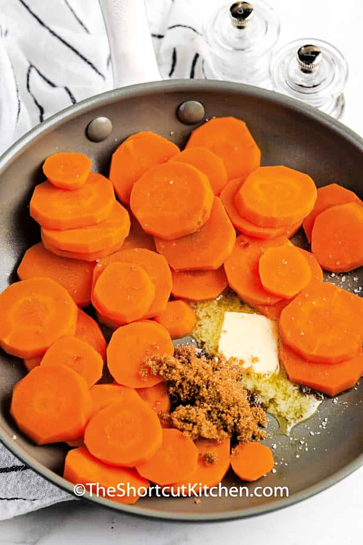 putting ingredients in pan to make Brown Sugar Carrots