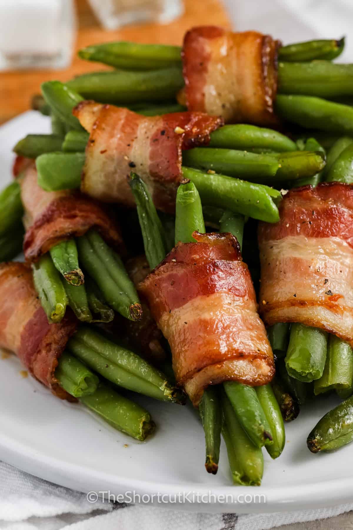 close up of Bacon Wrapped Green Beans on a plate
