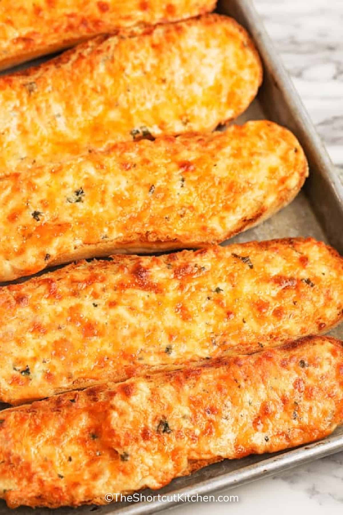 the best cheesy bread recipe on a baking sheet