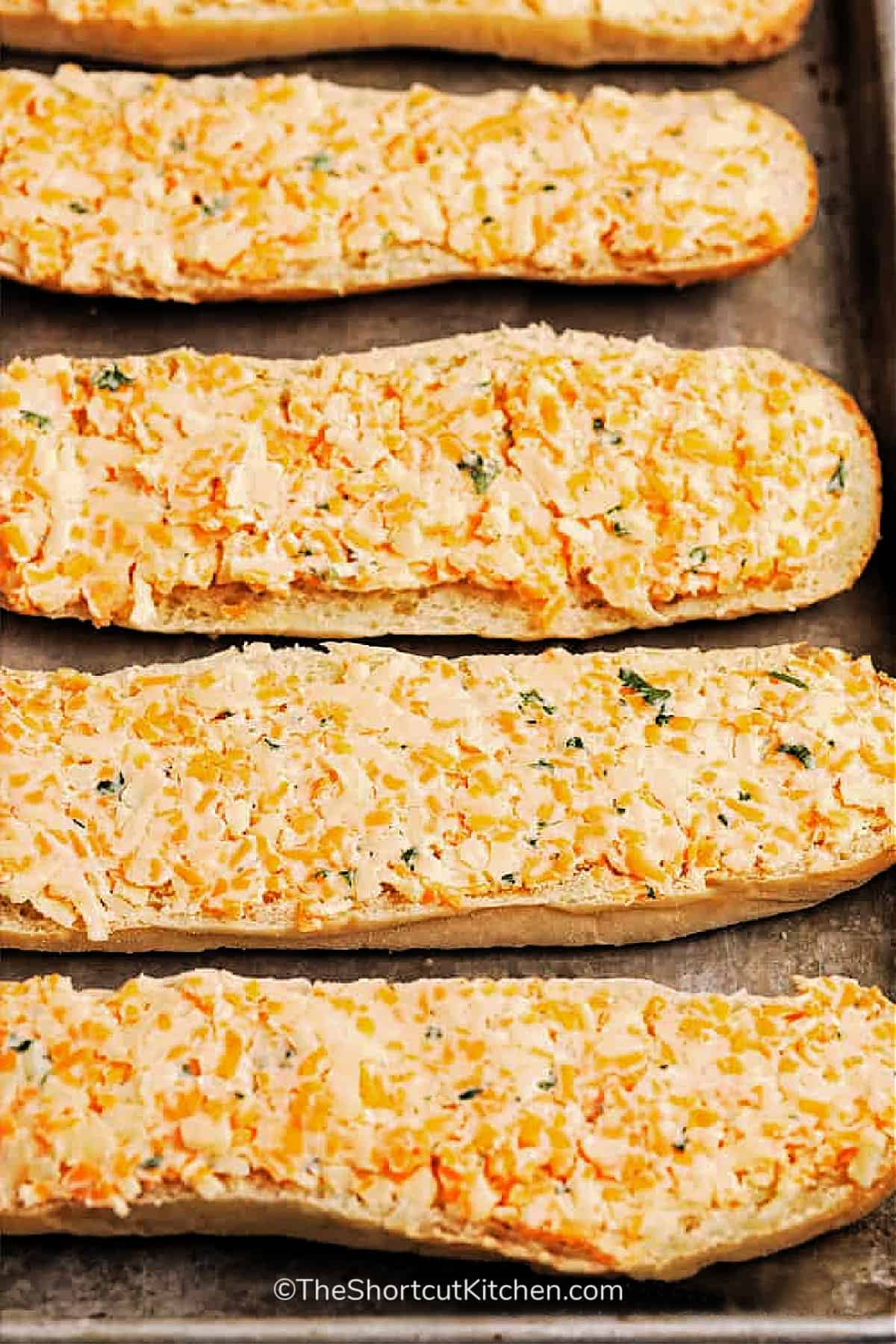 the best cheesy bread recipe, prior to baking, on a baking sheet