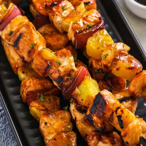cooked chicken kabobs on a grill