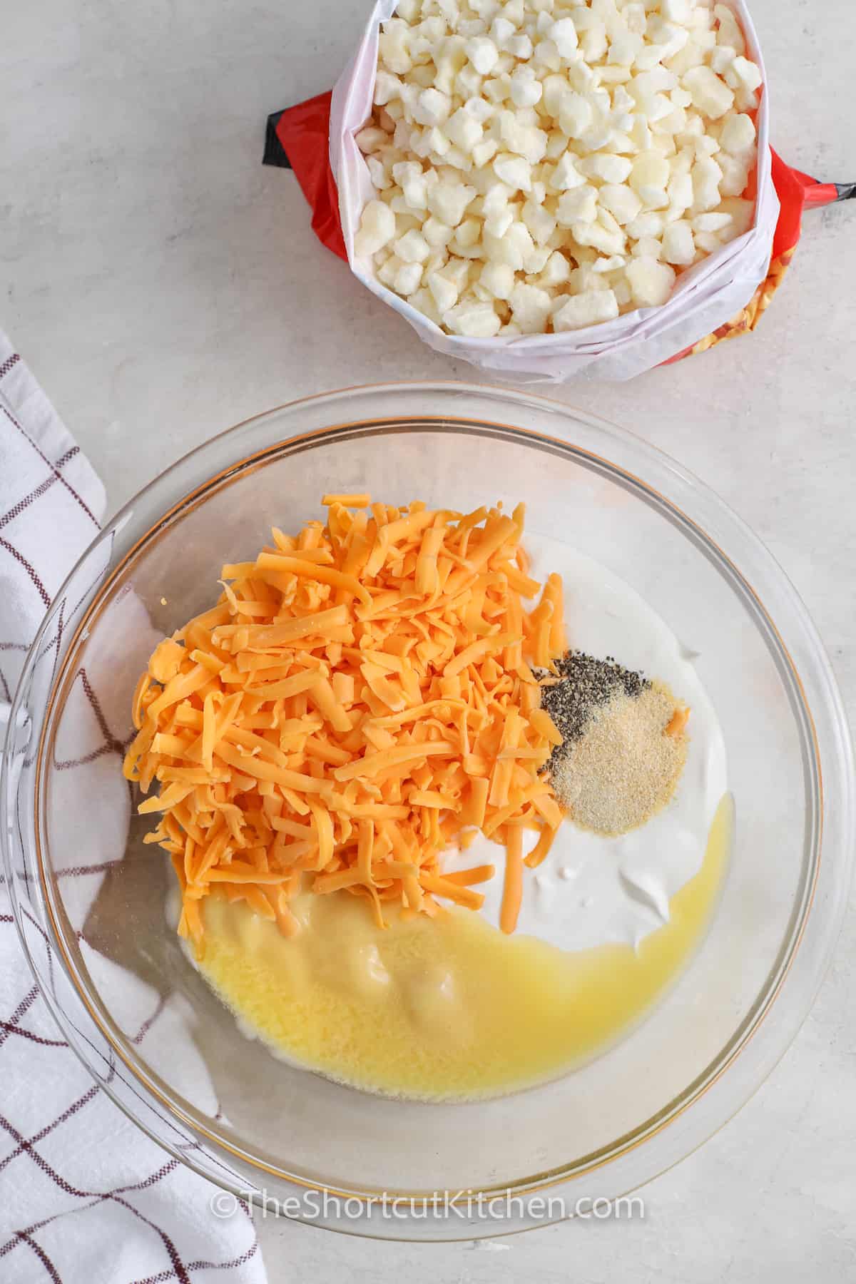 adding ingredients together to make cheese sauce for Funeral Potato Recipe