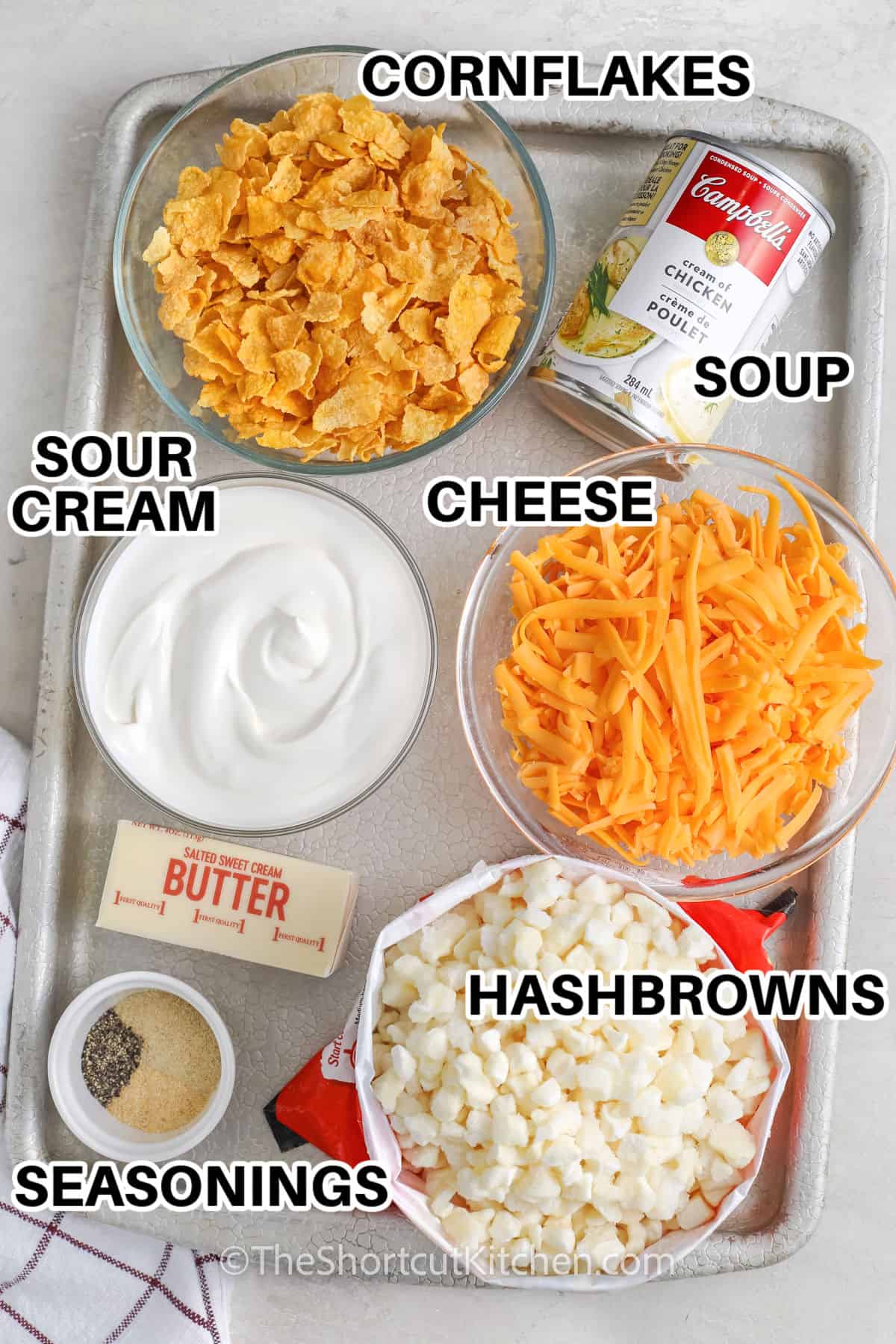cornflakes , soup , cheese , sour cream , butter , hash browns , cheese and seasonings with labels