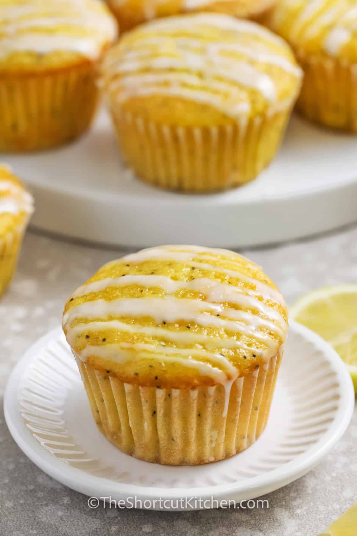 A Lemon poppyseed muffins with drizzle on a plate