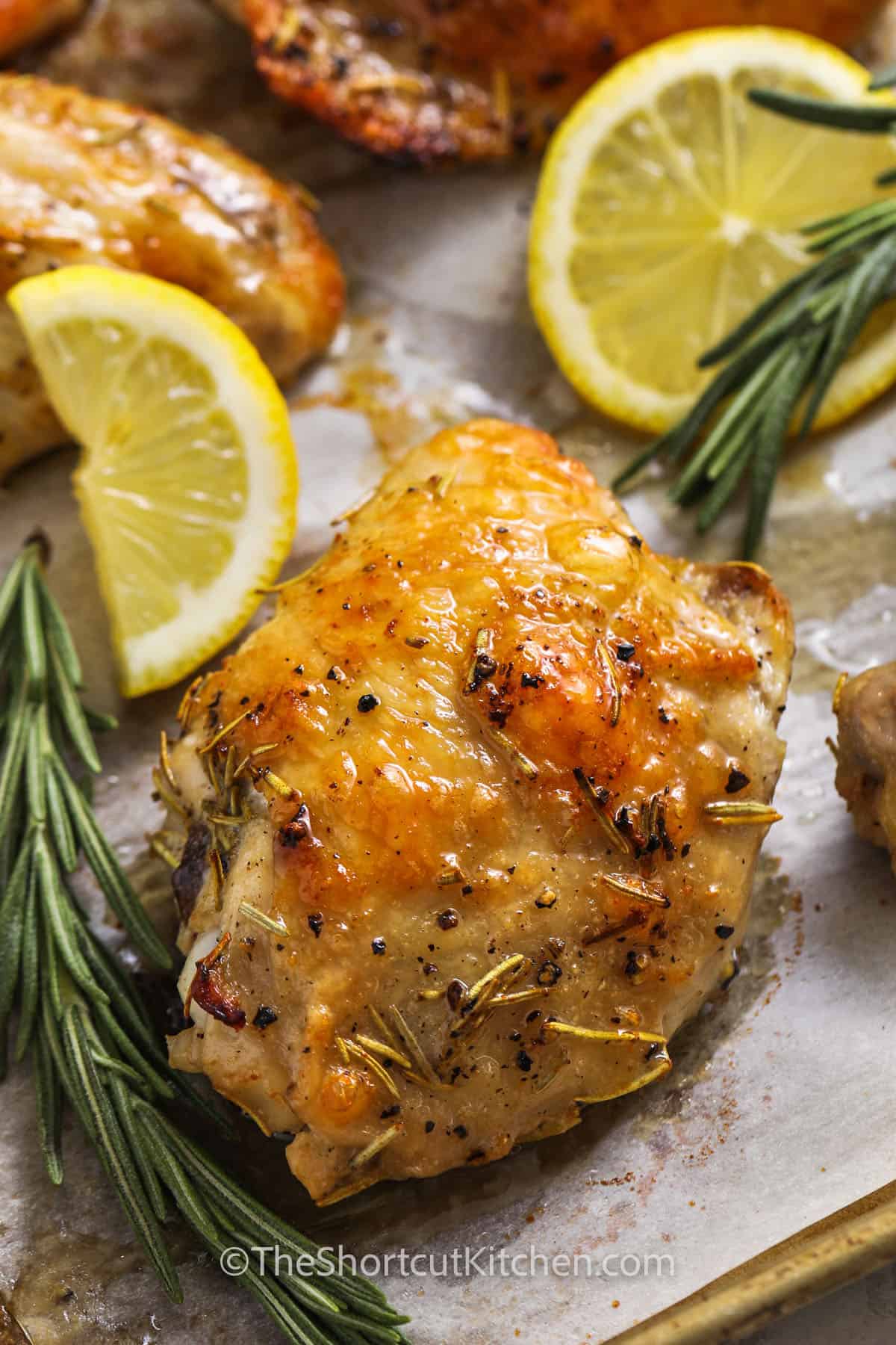 juicy Lemon Rosemary Chicken cooked on a sheet pan