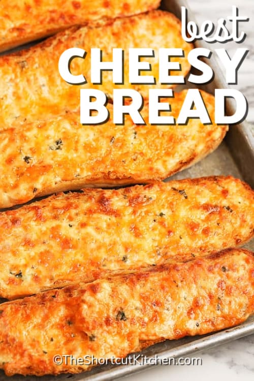 the best cheesy bread recipe on a baking sheet, with a title