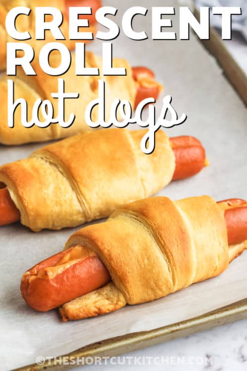 sheet pan of Crescent Roll Hot Dogs with a title