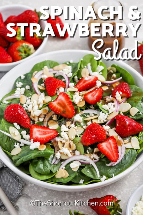 Spinach and Strawberry Salad in a white bowl with a title