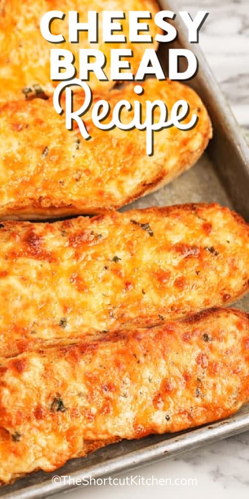 the best cheesy bread recipe on a baking sheet, with writing