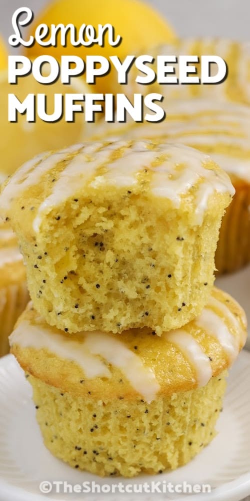 Two lemon poppyseed muffins stacked on a plate